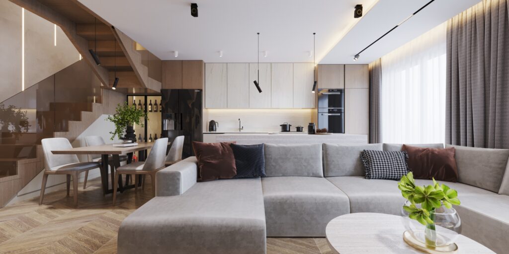 projektant wnętrz pokazuje salon z widokiem na kuchnię i schody
